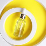 Glass dropper bottle with golden liquid representing Polysorbate 60, a non-ionic emulsifier used in skincare to stabilize oil-and-water formulations.