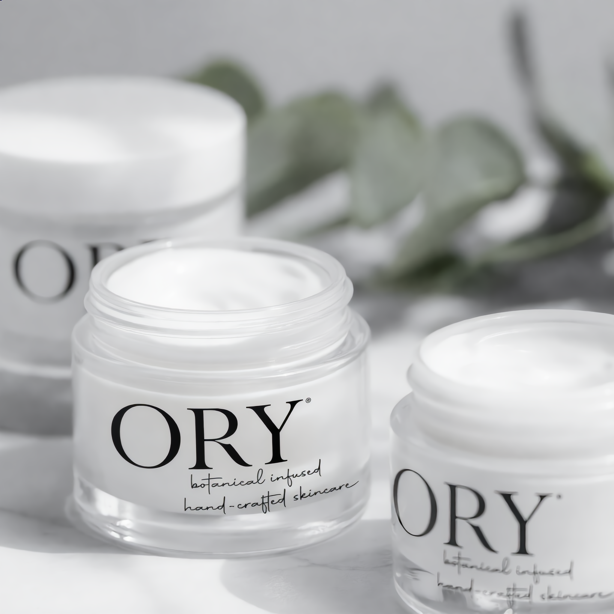 ORY botanical infused handcrafted cream jars with minimalist clear packaging for customized skincare formulation