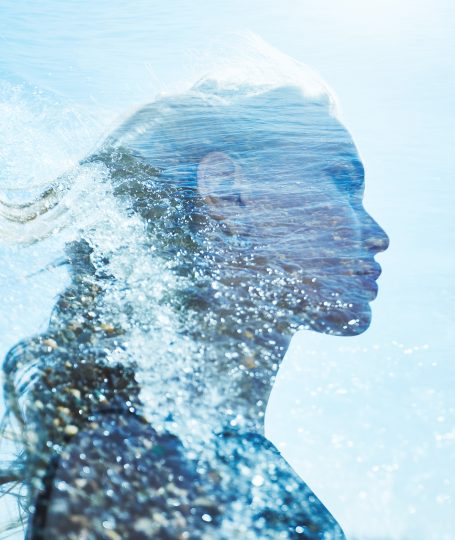 Abstract silhouette of a woman formed by flowing water and light, symbolizing ionized water in skincare and ORY’s science-driven hydration philosophy.