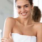 Woman with soft, hydrated skin wrapped in a towel, representing ORY Skincare’s pre-formulated bi-phasic toner for dry skin designed to replenish moisture, soothe sensitivity, and restore comfort.